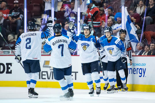 Aarne Talvitie of Finland celebrates with teammates