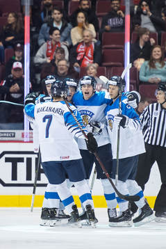 Jesse Ylönen of Finland celebrates with teammates