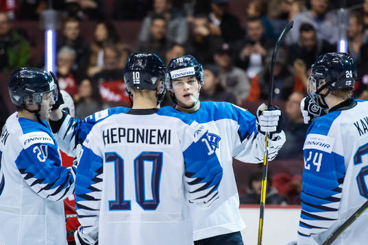 Rasmus Kupari of Finland celebrates with teammates