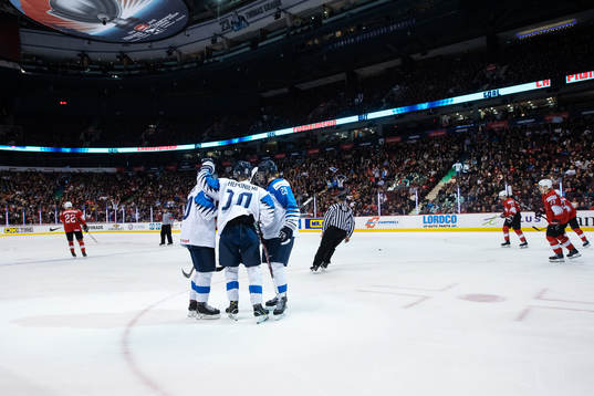 Aleksi Heponiemi (#10) of Finland celebrates with teammates