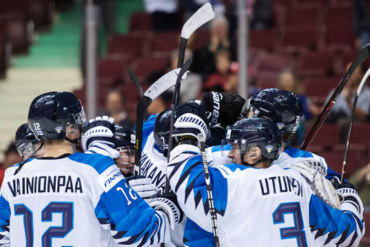 Players of team Finland celebrate their win