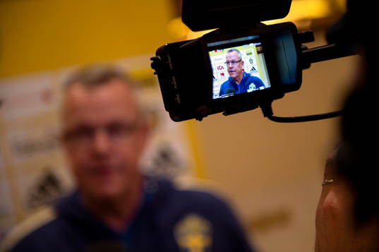 Head coach Janne Andersson of Sweden is shown trough a