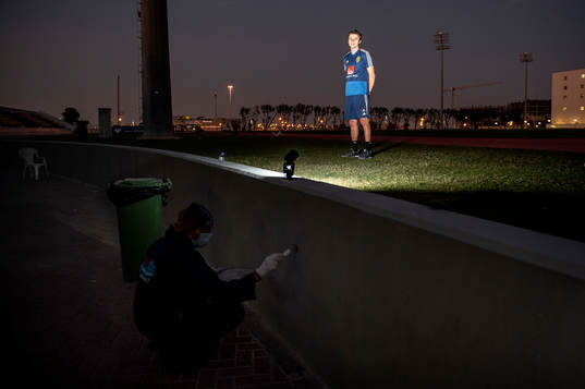 Sweden's Simon Thern poses for a portrait and a worker