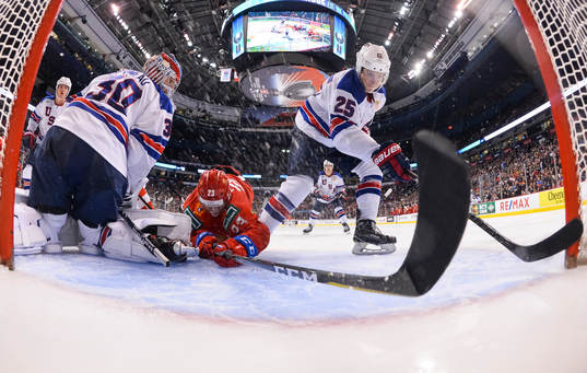 USA's Phil Kemp #25 clears the puck off the goalline while