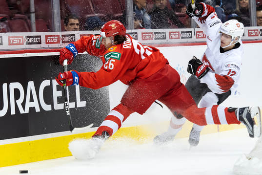 Alexander Romanov of Russia in action against Luca Wyss of