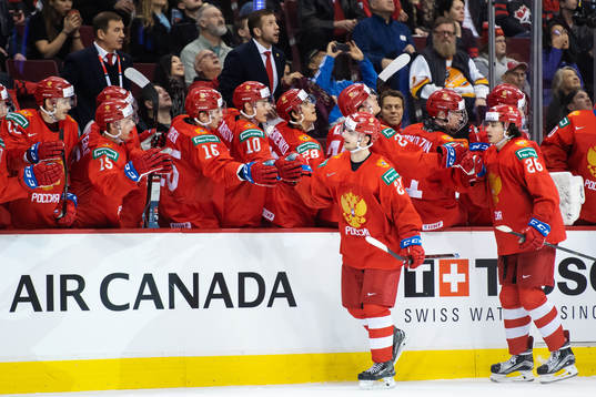 Kirill Slepets and Alexander Romanov of Russia celebrate