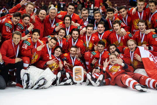 The players and coaching staff of team Russia celebrate