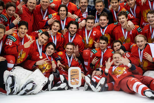 The players and coaching staff of team Russia celebrate