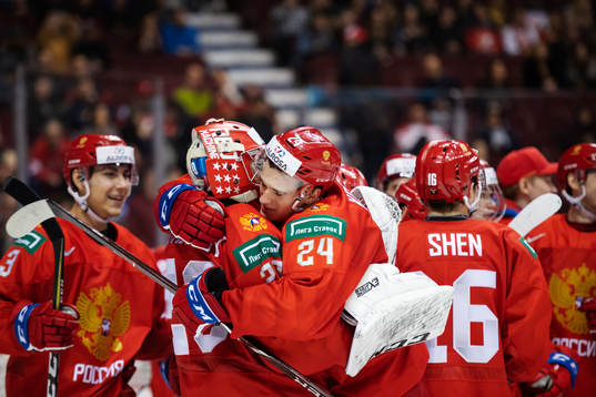 Goaltender Pyotr Kochetkov and Klim Kostin of Russia hug