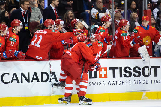 Klim Kostin hugs Kirill Slepets of Russia