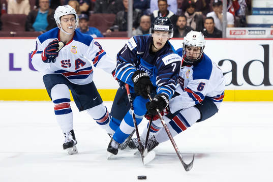 Tyler Madden and Jack Hughes of USA in action against Urho