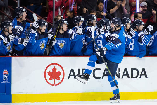 Kaapo Kakko of Finland celebrates with teammates