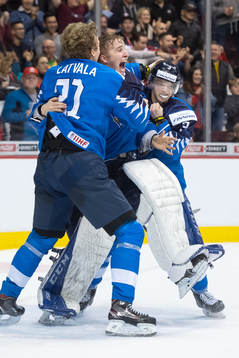 Otto Latvala, goaltender Ukko-Pekka Luukkonen and Toni