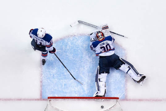 Ryan Poehling and goaltender Cayden Primeau of USA look