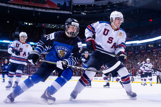 Kaapo Kakko of Finland and Ryan Poehling of USA