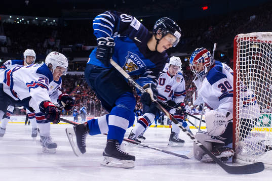Mikey Anderson and goaltender Cayden Primeau of USA are