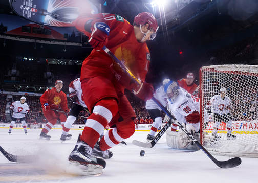 Stepan Starkov of Russia in action against goaltender Luca