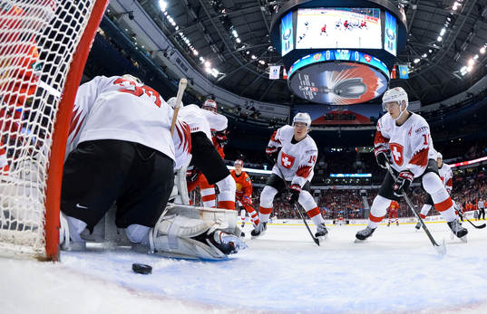 Switzerland's Luca Hollenstein #30, Sandro Schmid #14, and