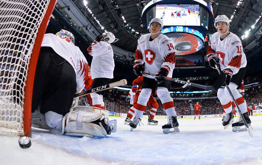Switzerland's Luca Hollenstein #30, Sandro Schmid #14, and