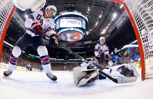 USA's Ryan Poehling #11 and Cayden Primeau #30 look