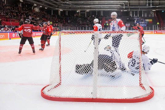 Joel Mustonen of Frölunda scores 1-0 behind goalkeeper