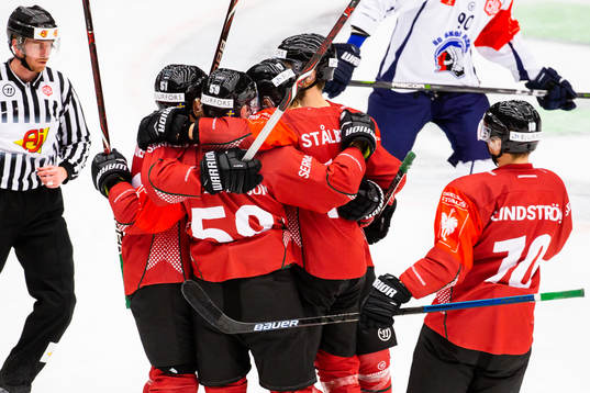 Simon Hjalmarsson of Frölunda celebrates with teammates