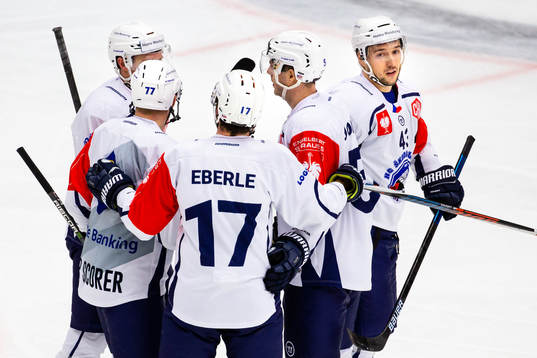Conor Allen of HC Plzens celebrates with teammates