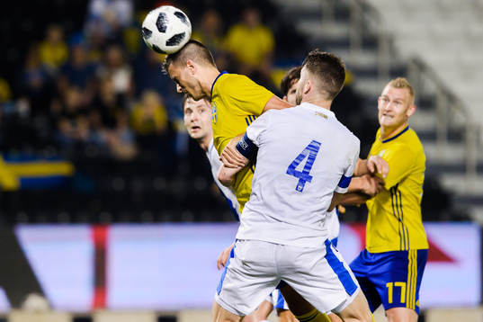 Joona Toivio of Finland in a duel with Alexander Jeremejeff