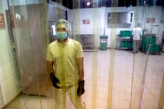 Workers in the kitchen in Challenger City, which is a