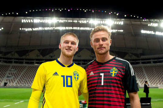 Sweden's Kalle Holmberg and goalkeeper Jacob Rinne
