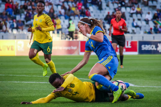 Noko Matlou of South Africa and Kosovare Asllani  of Sweden