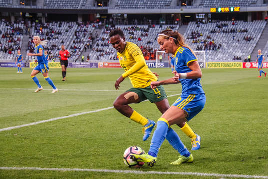Noko Matlou of South Africa and Kosovare Asllani of Sweden
