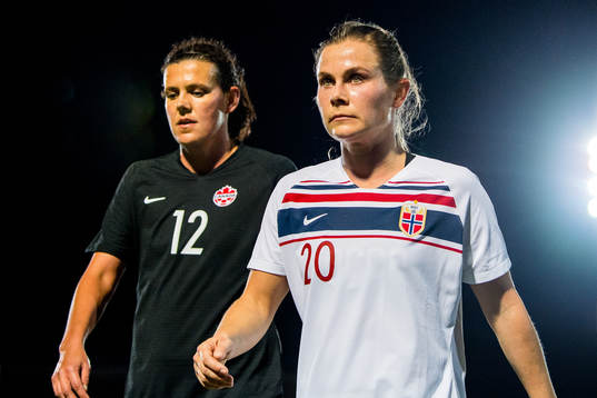 Christine Sinclair of Canada and Emilie Bosshard Haavi of