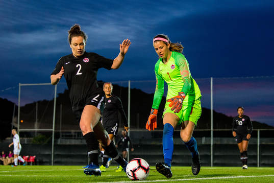 Allysha Chapman and goalkeeper Stephanie Labbe of Canada