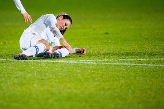 Ingrid Syrstad Engen of Norway lies down with an injury