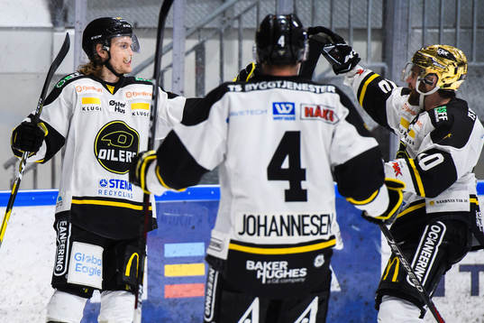 Mario Lucia celebrates with Johannes Johannesen and Jacob