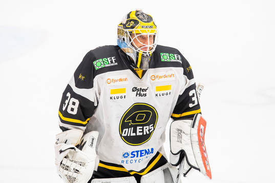 Goaltender Henrik Holm of Stavanger Oilers looks dejected