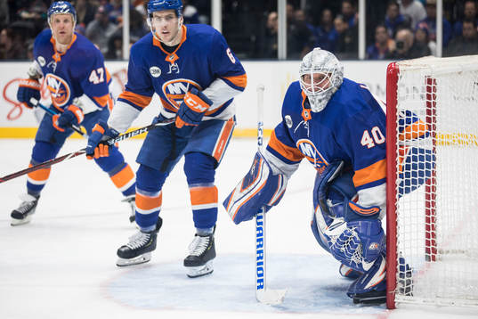 Leo komarov, Ryan Pulock and goalkeeper Robin Lehner of New