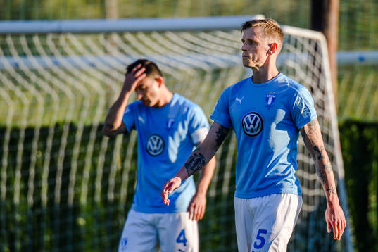 Behrang Safari and Sören Rieks of Malmö FF looks dejected