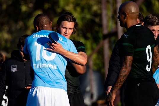 Carlos Strandberg of Malmö FF hugs Kristoffer Olsson of