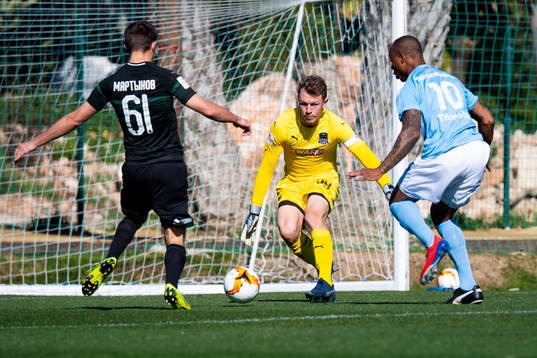 Matvei Safonov and Illya Martynov of Krasnodar with Carlos