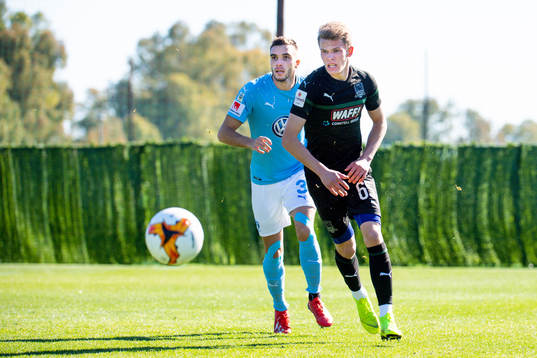 Egzon Binaku of Malmö FF and Nikolay Bochko of Krasnodar