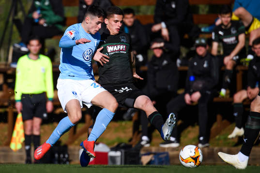 Laorent Shabani of Malmö FF and Mikhail Kolomiytsev of