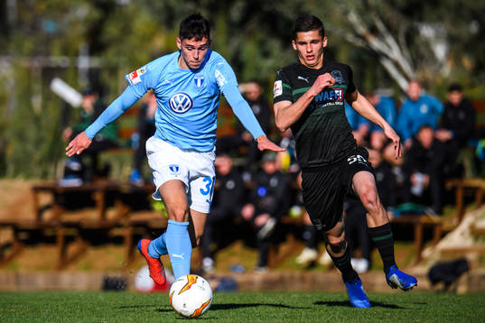 Laorent Shabani of Malmö FF and Mikhail Kolomiytsev of