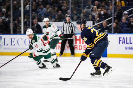 Matt Hendricks, Kyle Rau and Rasmus Dahlin