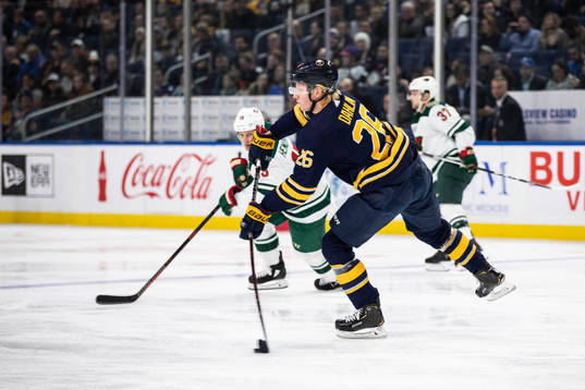 Matt Hendricks, Kyle Rau and Rasmus Dahlin