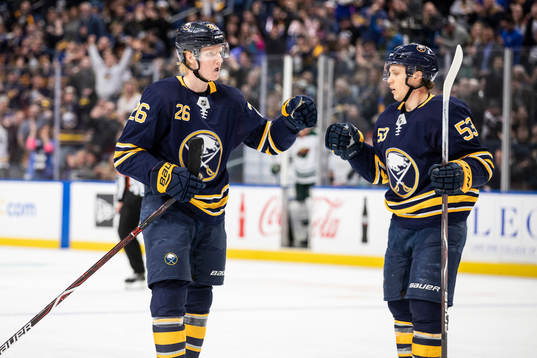 Rasmus Dahlin fist-bumps Jeff Skinner