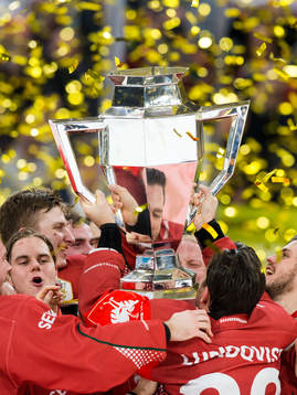 Joel Lundqvist of Frölunda lifts the trophy and celebrates
