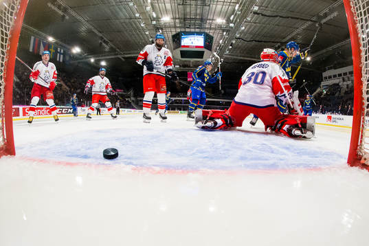 Emil Bemström of Sweden scores 0-1 behind goaltender Simon