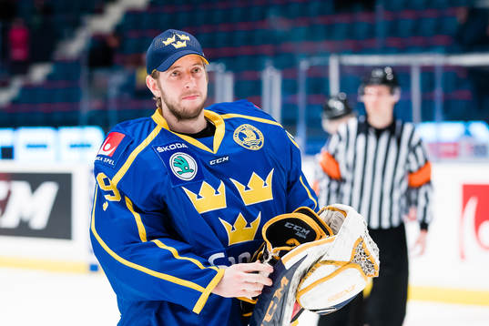 goaltender Adam Reideborn of Sweden looks dejected